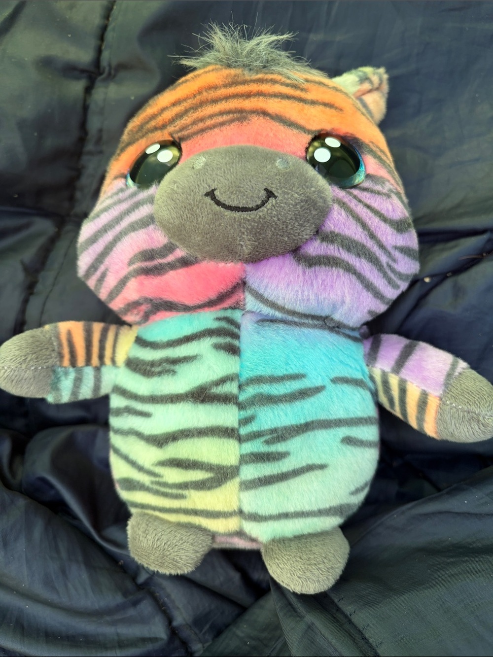 Jazwares Li'l Peepers Rainbow Zebra plush toy.